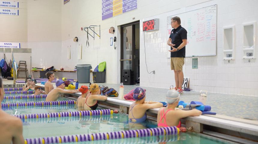 campers diving into the pool